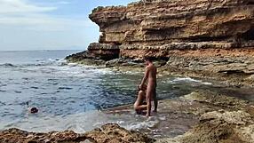 Divers watch us banging hard on the sunny beach.