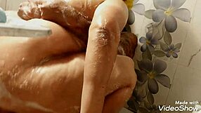 Big-tits wife gives hubby boob massage in garage, then blowjob to cum