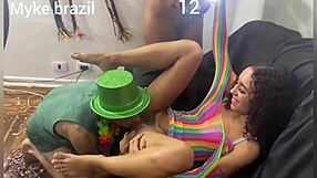 Carnival party with two beautiful women and nice friends having fun