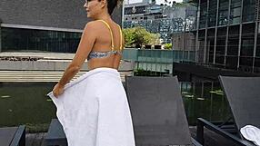 sexy brunette stands up to piss hot pee on legs in clubhouse shower close-up