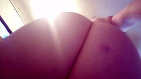 nude femdom engages in a solo masturbation session with sexting