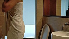 sexy brunette stands up to piss hot pee on legs in clubhouse shower close-up