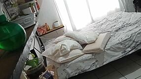 A voyeur watches a mature, curly-haired MILF clean her bedroom