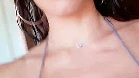 A European beauty in a silver bikini, solo pleasure