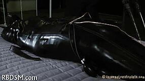 Bound in tight bondage, the submissive endures sadomasochistic pleasures with ropes and restraints