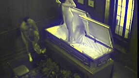 A couple’s hardcore sex session in a coffin which was spied on by hidden cameras ends with a facial