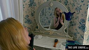 I'm a horny blonde in fishnets, riding my huge black dildo doggy style.