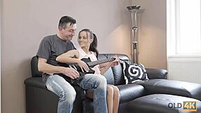 Old guitarist fucks adorable euro brunette on sofa.