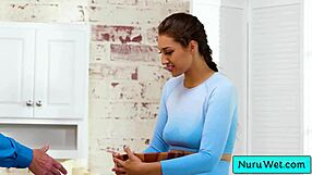 Busty teen masseuse applies nuru gel and rubs client