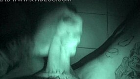 Watch this tattooed guy stroke his cock late at night!