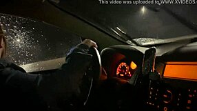 Young woman with big breast gives a blow job in a parking lot