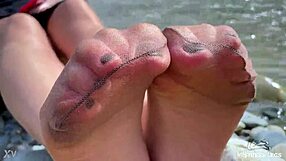 Goddess in Tan Nylons Teases with Cute Soles by Riverside