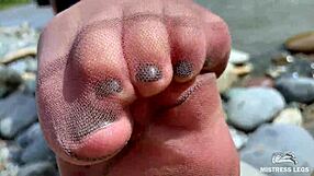 Goddess in Tan Nylons Teases with Cute Soles by Riverside