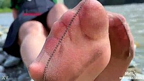 Goddess in Tan Nylons Teases with Cute Soles by Riverside