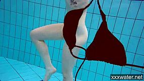 Russian beauties swim and pose in the bikini in the pool
