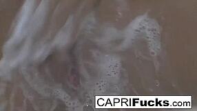 capri fingers her tight cunt with big tits and ass on display