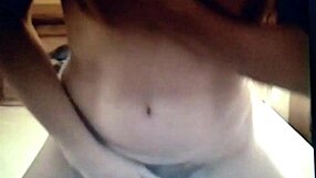 Masturbating Brunette Rubs Clit on Bed in Solo Amateur Action