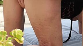 Mature amateurs passionately making love in the garden.