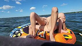This athletic couple goes for outdoor sex on a jetski in the lake middle. She RIDES his big cock in cowgirl then bends over for doggystyle pounding.