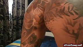 Sexy amateur tattoo babe enjoys using a dildo on her webcam.