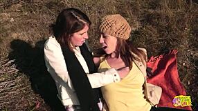 A couple of tattooed brunettes enjoy wild strapon sex on an outdoor hike