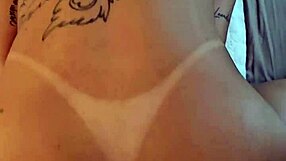 Kalena Mitrak rides dildo in bedroom while talking dirty about wanting double penetration. She squirts in orgasm as husband watches cuckold scene.