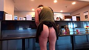 Curvy milf stages skirt malfunction outdoors flashing big ass and thong to public crowd.