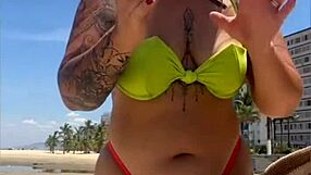 Wow, married babe draws eyes on the beach flashing in her tiny bikini!