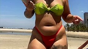 Wow, married babe draws eyes on the beach flashing in her tiny bikini!