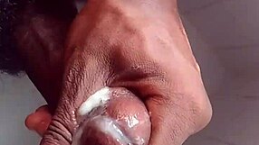 Black guy masturbates big cock solo in USA shower bath