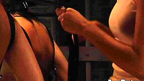 two hot lesbian slaves tied up together by dominant madame, contrasting submission with intense domination