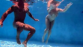 Australian chick gets underwater fuck with golden shower facial in outdoor public toilet sport scene.