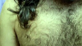 hairy bodybuilder shows off muscular arms and long hair in outdoor striptease with clothes ripped for 10 uncut minutes.