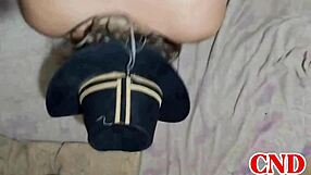 In the dorm, the Brazilian girlfriend bends over on the bed as the husband watches her scream during intense action