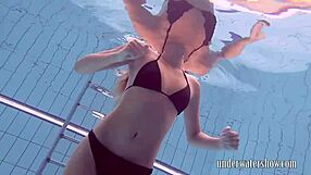 Does Lucy Really Remove Her Bikini While Swimming in the Pool?