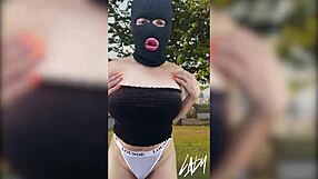 Horny Asian shemale with big ass and tits fingering herself in public park