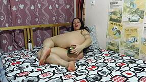 Chubby Milf Stretches Shaved Pussy with Wide Bottle on Bed