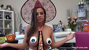 abigail mac contrasts big tits and brunette allure in intriguing halloween pussy solo masturbation