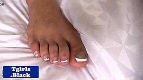 Tattooed Black Tgirl Strokes Pierced Cock Close-Up