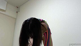 imagine this cute japanese girl's nice tits as she slips into clothes