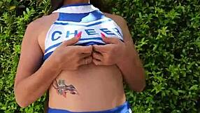 super hot cheerleader flashes natural tits and teases naked outdoors for neighbors