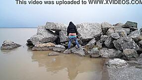 hey check this milf pissing outdoors in the sea with her hairy bush fetish vibes