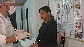 gynecologist examines brazilian lesbian couple as one scrolls phone during foreplay