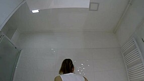 Sexy college brunette lifts mini skirt in bathroom flashing panties and socks