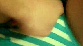 her fingers slide deep into wet pussy through striped cotton panties teasing endlessly