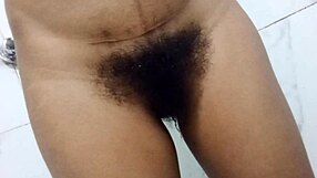 Desi Indian teen flashes her amazing hairy pussy and huge natural tits in steamy indoor homemade video