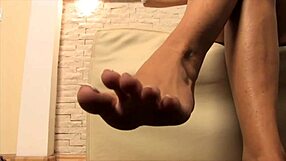 goddess dangles heels teasing her perfect barefoot soles