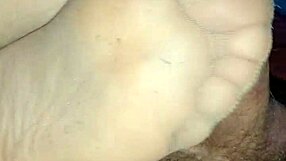 my girlfriend gives homemade sensual footjob teasing toes in tan stockings