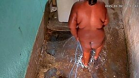 hidden cam catches busty stepmom bathing and flashing huge tits outside